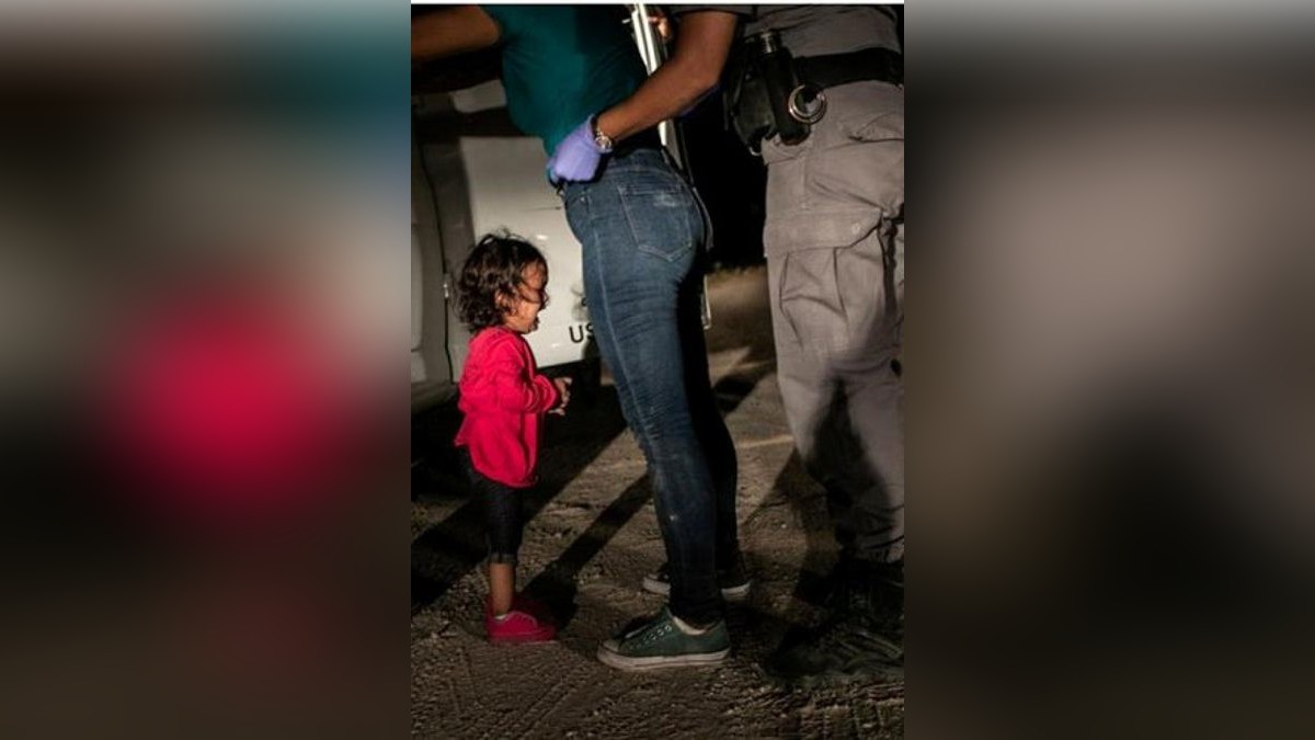 Caption: Yana, from Honduras, cries as her mother Sandra Sanchez is searched by a US Border Patrol agent, in McAllen, Texas, USA, on 12 June 2018.Story: Immigrant families had rafted across the Rio Grande from Mexico and were detained by the authorities. Yana (who was approaching her second birthday) and her mother had been part of a refugee caravan that started its journey in southern Mexico in April. On 6 April, the US Attorney General Jeff Sessions had announced a âzero toleranceâ immigration policy, stating that people caught entering the US illegally would be criminally prosecuted. Soon afterwards, news outlets began to report that parents who had been apprehended were being separated from their children. Yanaâs father, still in Honduras, later made it clear that Yana and Sandra had not been parted. Nevertheless, public outcryâin which this image played a roleâresulted in President Donald Trump halting family separations on 20 June 2018.Foto: WP