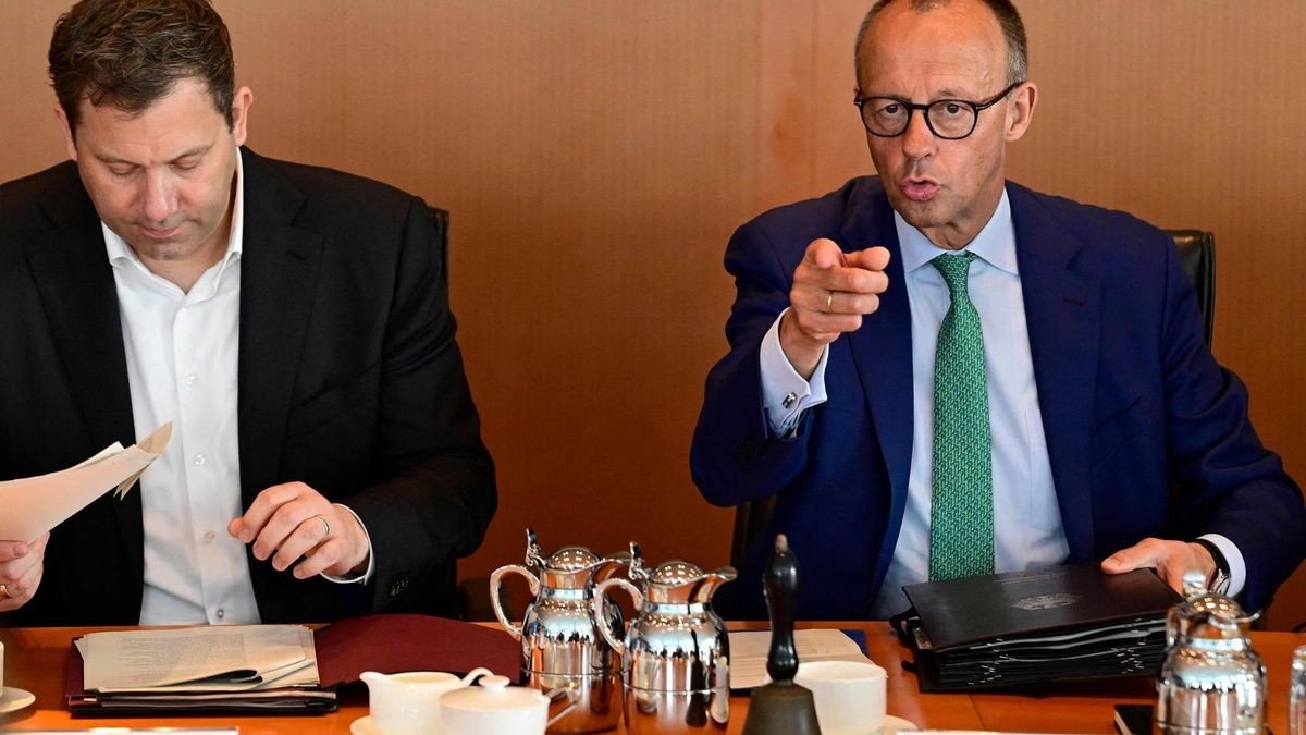German Chancellor Friedrich Merz (R) gestures next to German Finance Minister and Vice Chancellor Lars Klingbeil prior to the start of the weekly cabinet meeting at the Chancellery in Berlin on July 16, 2025. (Photo by John MACDOUGALL / AFP)