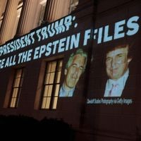 WASHINGTON, DC - JULY 18: An image of U.S. President Donald Trump and Jeffrey Epstein, along with the words “President Trump: Release All the Epstein Files”, is projected onto the U.S. Department of Commerce headquarters on July 18, 2025, in Washington, D.C. Earlier today, the Department of Justice asked federal judges to unseal files in the criminal cases of Jeffrey Epstein and Ghislaine Maxwell. Anna Moneymaker/Getty Images/AFP (Photo by Anna Moneymaker / GETTY IMAGES NORTH AMERICA / Getty Images via AFP) Activists Project Message To Trump Calling For Release Of Epstein Files