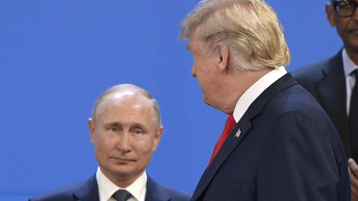 (FILES) US President Donald Trump (R) looks at Russia's President Vladimir Putin before posing for a family photo during the G20 Leaders' Summit in Buenos Aires, on November 30, 2018. US President Donald Trump said on August 8, 2025 he would meet with Russian counterpart Vladimir Putin on August 15 in Alaska, as the Republican billionaire hopes to help mediate an end to the war in Ukraine. (Photo by Juan Mabromata / AFP)