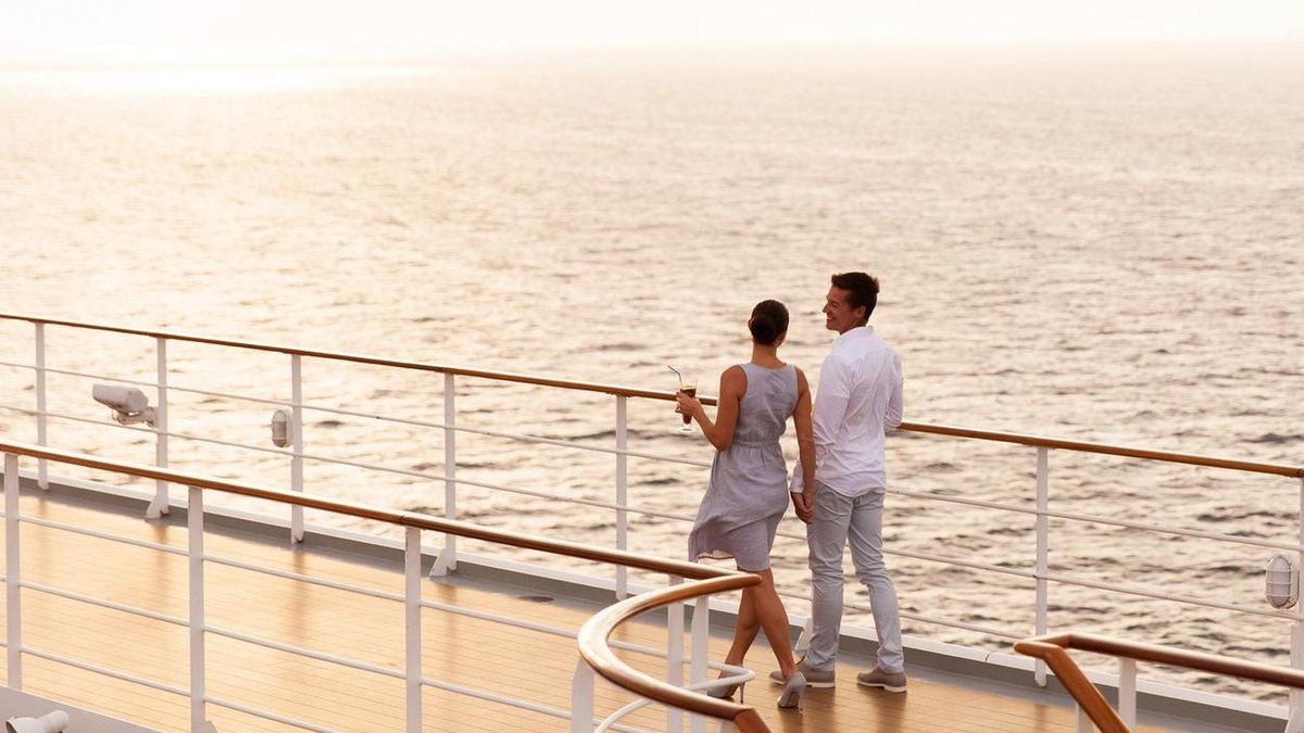 couple walking on cruise ship deck