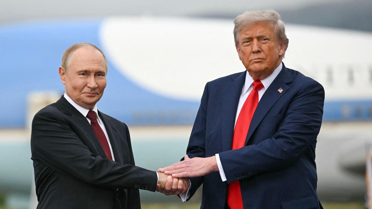 (FILES) US President Donald Trump greets Russian President Vladimir Putin on the tarmac after they arrived at Joint Base Elmendorf-Richardson in Anchorage, Alaska, on August 15, 2025. US President Donald Trump said he and Russian leader Vladimir Putin had made 'great progress' in a telephone call October 16, 2025, and had agreed to meet in Budapest at an unconfirmed date. The meeting in the Hungarian capital would be 